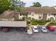 Aerial view of the complex with covered parking and beautiful landscaping at 3540 Countrybrook Ln # 23, Palm Harbor, FL 34684