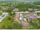 Birds eye view showcases community design with buildings, covered parking, and landscape at 3540 Countrybrook Ln # 23, Palm Harbor, FL 34684