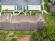Aerial view of community roofs and parking, revealing the well-maintained property at 3540 Countrybrook Ln # 23, Palm Harbor, FL 34684