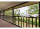 Balcony with a view of lush landscaping and neighboring homes at 3540 Countrybrook Ln # 23, Palm Harbor, FL 34684