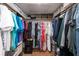 Walk-in closet providing ample storage with upper shelving at 3540 Countrybrook Ln # 23, Palm Harbor, FL 34684