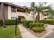 Charming two-story condo with lush landscaping and a well-manicured lawn at 3540 Countrybrook Ln # 23, Palm Harbor, FL 34684