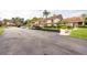 Well-maintained parking lot with covered parking spaces and manicured landscaping at 3540 Countrybrook Ln # 23, Palm Harbor, FL 34684