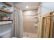 Tiled shower with built-in shelves and neutral tones at 3540 Countrybrook Ln # 23, Palm Harbor, FL 34684