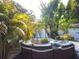 Beautiful backyard featuring gravel, artificial turf, lush landscaping, and a cozy seating area at 3545 7Th N Ave, St Petersburg, FL 33713