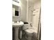 Functional bathroom with a pedestal sink, tiled shower, and modern fixtures at 3545 7Th N Ave, St Petersburg, FL 33713