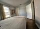 Bedroom with hardwood floors, natural light from the window, and a doorway to an adjoining room at 3545 7Th N Ave, St Petersburg, FL 33713