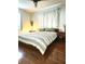 Cozy bedroom featuring a queen-sized bed, hardwood floors and natural light at 3545 7Th N Ave, St Petersburg, FL 33713