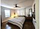 Comfortable bedroom features a queen-sized bed, modern ceiling fan, and natural light at 3545 7Th N Ave, St Petersburg, FL 33713
