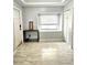 Entryway with tiled floors, natural light from a window, and a convenient storage closet at 3545 7Th N Ave, St Petersburg, FL 33713
