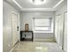 Entryway with tiled floors, natural light from a window, and a convenient storage closet at 3545 7Th N Ave, St Petersburg, FL 33713