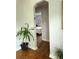 Cozy hallway with hardwood floors and a plant, leading to the bedroom at 3545 7Th N Ave, St Petersburg, FL 33713