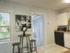 Eat in kitchen with an attached pantry, white cabinets, black appliances, and natural light at 3545 7Th N Ave, St Petersburg, FL 33713