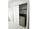 Laundry area featuring a modern washer and dryer neatly tucked behind folding closet doors at 3545 7Th N Ave, St Petersburg, FL 33713