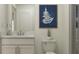 Bright bathroom featuring a modern vanity, stylish decor, and a glass-enclosed shower for a spa-like experience at 3576 Silent Gardens Cv, Wesley Chapel, FL 33543