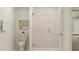 Elegant bathroom featuring a glass-enclosed shower, neutral tile, and contemporary fixtures at 3584 Silent Gardens Cv, Wesley Chapel, FL 33543