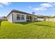 Wide shot of a well-maintained backyard with lush green grass and new landscaping at 4365 Frontera Ln, Wesley Chapel, FL 33543