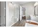 Bathroom showcasing a glass-enclosed shower, double vanity, and tile flooring at 4365 Frontera Ln, Wesley Chapel, FL 33543