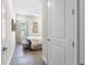 Cozy bedroom with wood-look flooring, neutral decor, and a view of the hallway at 4365 Frontera Ln, Wesley Chapel, FL 33543