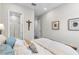 Bedroom featuring a cozy bed and an ensuite bathroom with glass shower at 4365 Frontera Ln, Wesley Chapel, FL 33543