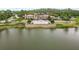 Beautiful aerial view of community clubhouse near the lake surrounded by trees and landscaping at 4365 Frontera Ln, Wesley Chapel, FL 33543