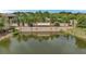 Estancia community entrance with brick walls, stone accents, and a serene water feature in the foreground at 4365 Frontera Ln, Wesley Chapel, FL 33543