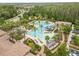 Aerial view of community pools, lounging areas, lush landscaping, and gathering spots at 4365 Frontera Ln, Wesley Chapel, FL 33543