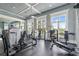 Well-equipped gym with various exercise machines, natural light, and mirrored walls, promoting a healthy lifestyle at 4365 Frontera Ln, Wesley Chapel, FL 33543