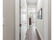 Hallway with wood floors leading to a bright, airy living space at 4365 Frontera Ln, Wesley Chapel, FL 33543