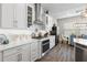 Bright kitchen featuring white cabinetry, stainless steel appliances, and modern finishes for a stylish look at 4365 Frontera Ln, Wesley Chapel, FL 33543