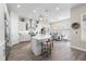 Modern kitchen features an island and a view to the dining area at 4365 Frontera Ln, Wesley Chapel, FL 33543