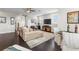 Open concept living area with hardwood floors, comfortable seating, and ample natural light at 4365 Frontera Ln, Wesley Chapel, FL 33543