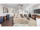 Bright living room with hardwood floors, lots of comfortable seating, and stylish decor at 4365 Frontera Ln, Wesley Chapel, FL 33543