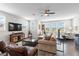 Spacious living room with hardwood floors, modern furnishings, and plenty of natural light at 4365 Frontera Ln, Wesley Chapel, FL 33543