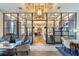 Elegant lobby with high ceilings, stylish seating, and floor-to-ceiling glass doors, creating an inviting entrance at 4365 Frontera Ln, Wesley Chapel, FL 33543