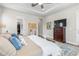 Comfortable main bedroom showcasing a dresser, mirror and walk-in closet at 4365 Frontera Ln, Wesley Chapel, FL 33543