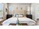 Inviting main bedroom with stylish furnishings, wood-look floors, and a calming color scheme at 4365 Frontera Ln, Wesley Chapel, FL 33543