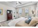 Bright main bedroom with large windows, ceiling fan, and comfortable furnishings at 4365 Frontera Ln, Wesley Chapel, FL 33543