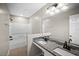 Beautiful bathroom with double sinks, granite counters, and a shower-tub combo with modern fixtures at 4535 Winding River Way, Land O Lakes, FL 34639