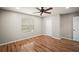 Bedroom featuring hardwood floors, a modern ceiling fan and closet for optimal storage at 4535 Winding River Way, Land O Lakes, FL 34639