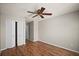 Bedroom featuring hardwood floors, a ceiling fan and closet at 4535 Winding River Way, Land O Lakes, FL 34639