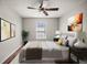 Cozy bedroom with ceiling fan, natural light and neutral décor provides a peaceful retreat at 4535 Winding River Way, Land O Lakes, FL 34639