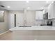 Bright kitchen showcasing white cabinets, modern appliances, and a sleek countertop for cooking at 4535 Winding River Way, Land O Lakes, FL 34639