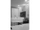 Updated kitchen with white cabinets, modern appliances, and a stylish backsplash at 4535 Winding River Way, Land O Lakes, FL 34639