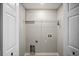 Laundry room area with hookups and storage shelf at 4535 Winding River Way, Land O Lakes, FL 34639