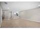 Open layout showcases the kitchen, appliances, and living space with tiled flooring at 4535 Winding River Way, Land O Lakes, FL 34639