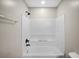 Bright bathroom features an updated shower with modern fixtures and a tiled shower surround at 4535 Winding River Way, Land O Lakes, FL 34639