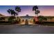 Welcoming clubhouse exterior framed by palm trees and manicured landscaping, creating an inviting entrance at 4550 Cove Cir # 502, St Petersburg, FL 33708