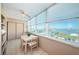 Bright dining area with large windows showcasing city and water views at 4550 Cove Cir # 502, St Petersburg, FL 33708