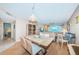 Open dining area leading to the living room, complemented by views of the water at 4550 Cove Cir # 502, St Petersburg, FL 33708
